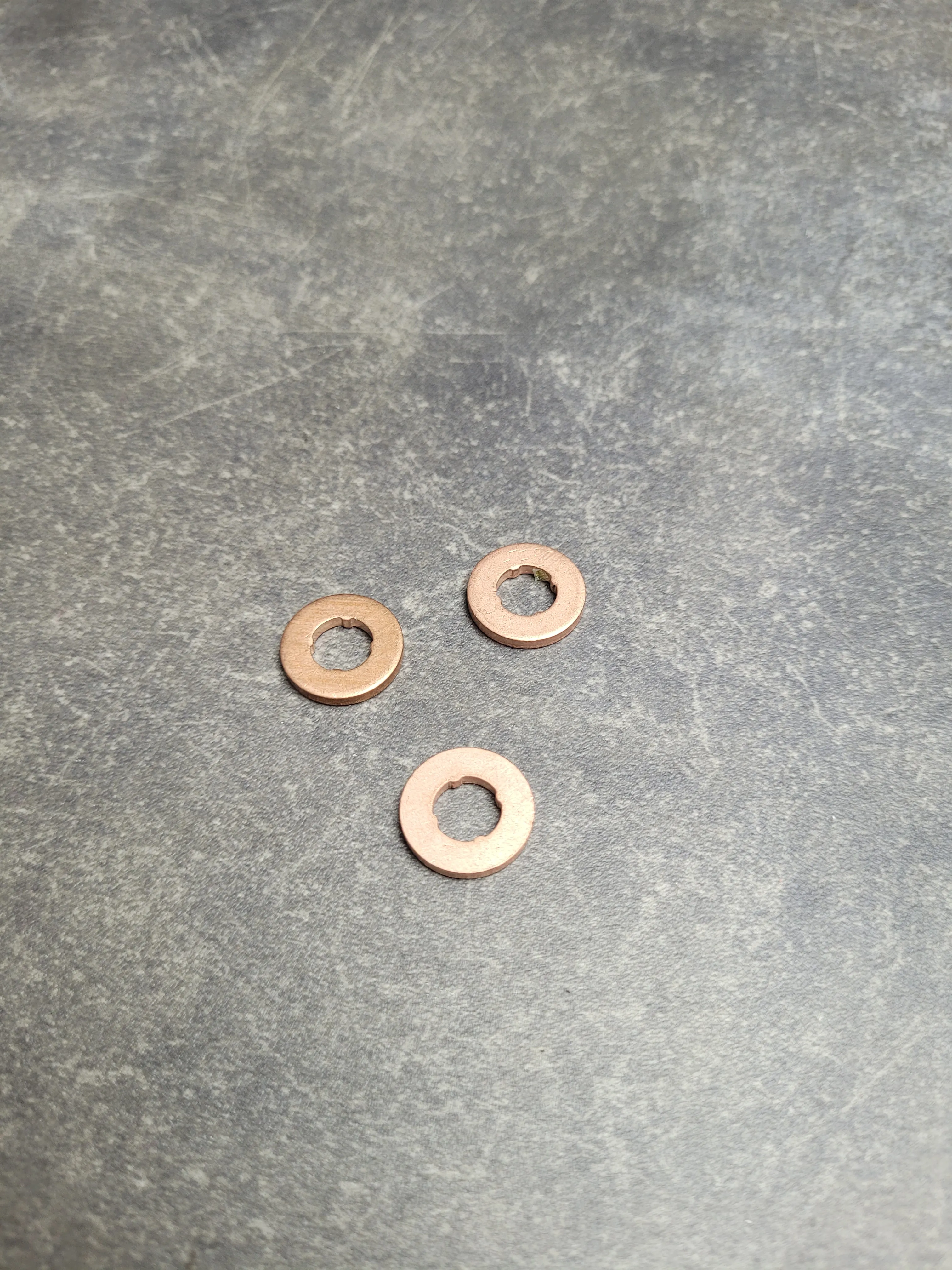 Кольцо форсунки топливной нижнее [медь] M57 (с 03.2000) (9-27)